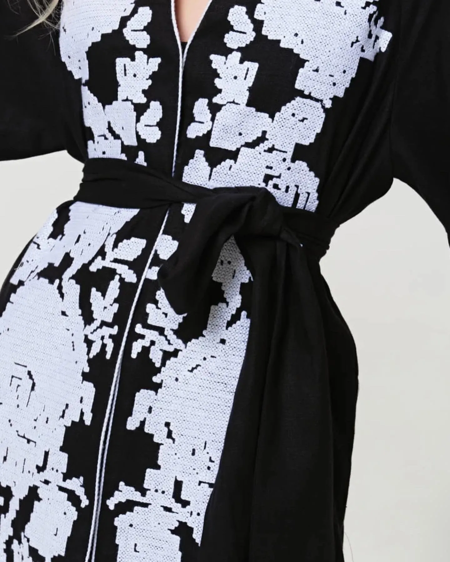 Black dress with white embroidery