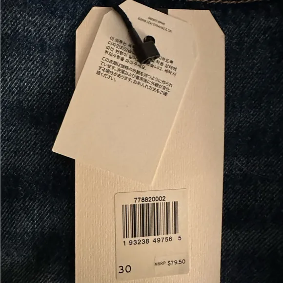 Levi's high-rise deconstructed denim mini skirt. Button fly. Size 30. New.